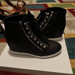 Used Just Fab black boogie tennis shoe.